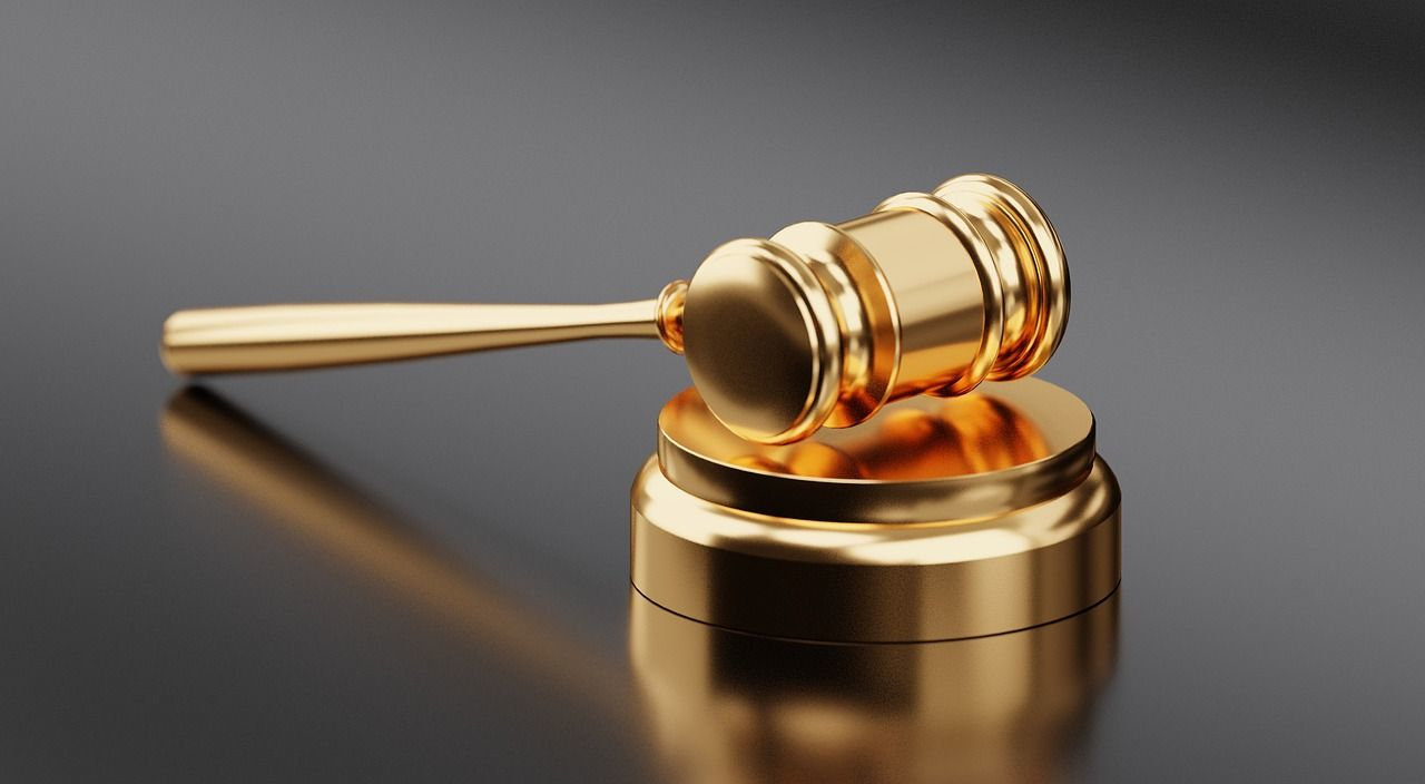 A golden gavel on the table