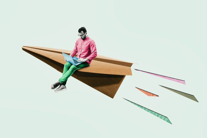 Paper plane with sitting young man. New startup launch, business ideas, creativity.