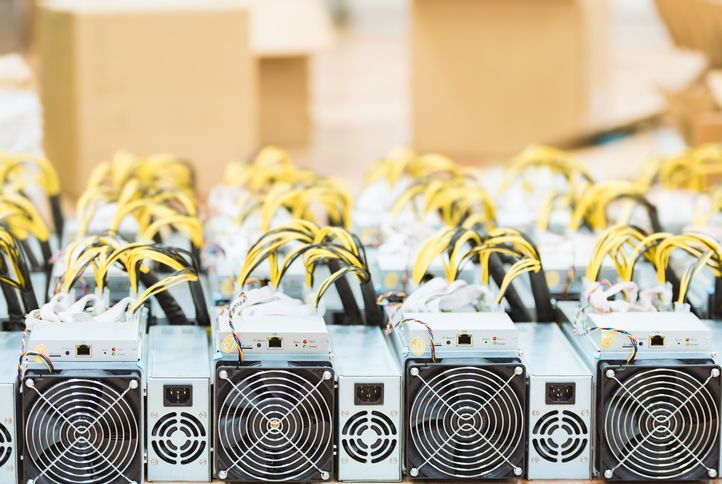 A stock image of several mining devices with yellow wires. 