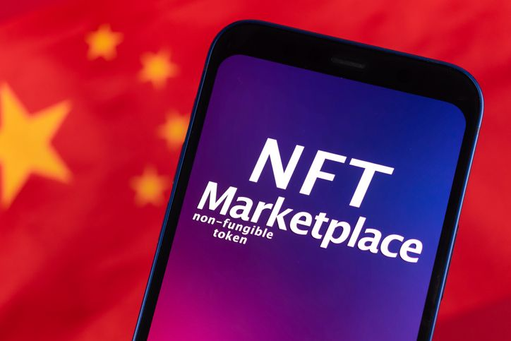 A stock image of the NFT marketplace on smartphone with the flag of China in background. 