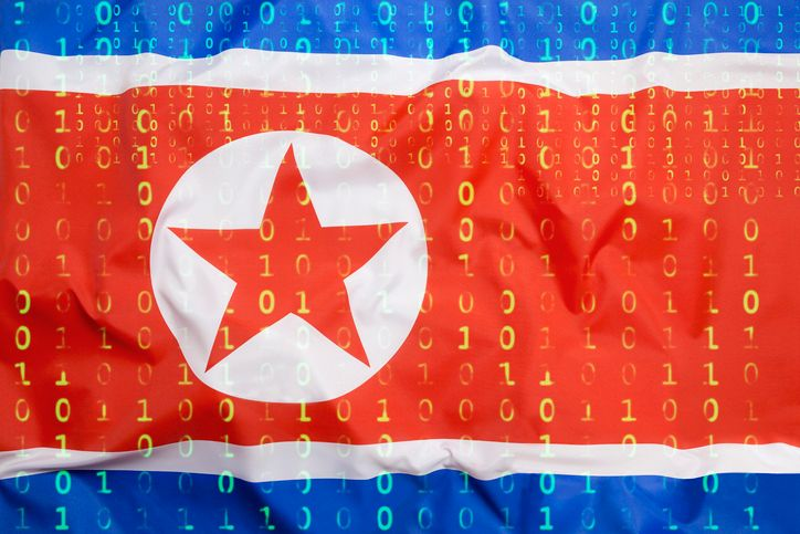 A stock photo featuring binary code on the North Korean flag