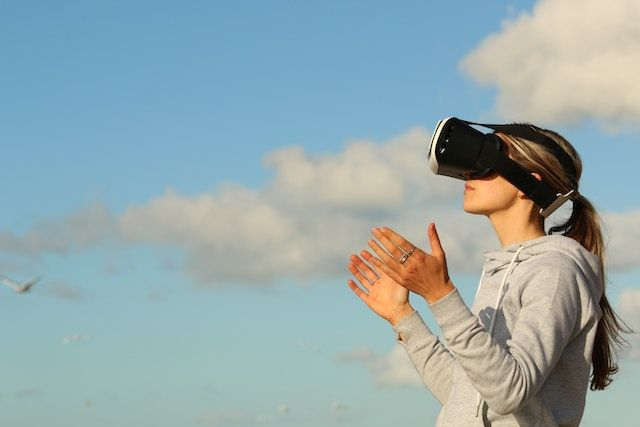 A woman wearing VR goggles.
