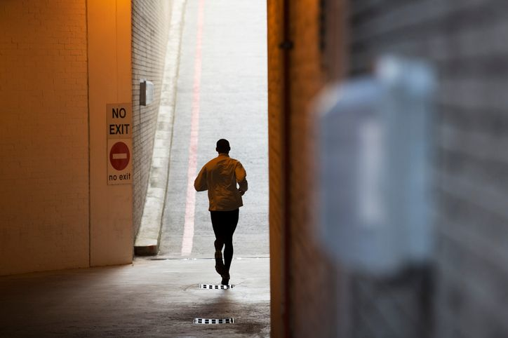Man running through city streets - stock ph
