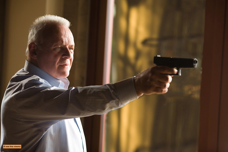 Anthony Hopkins in Fracture, holding up a gun