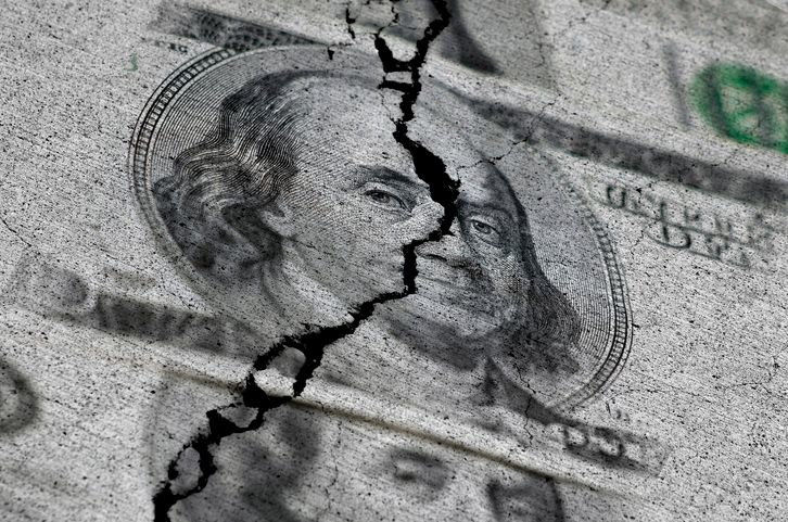 A crack over the dollar banknote symbolizing loss of a peg. 