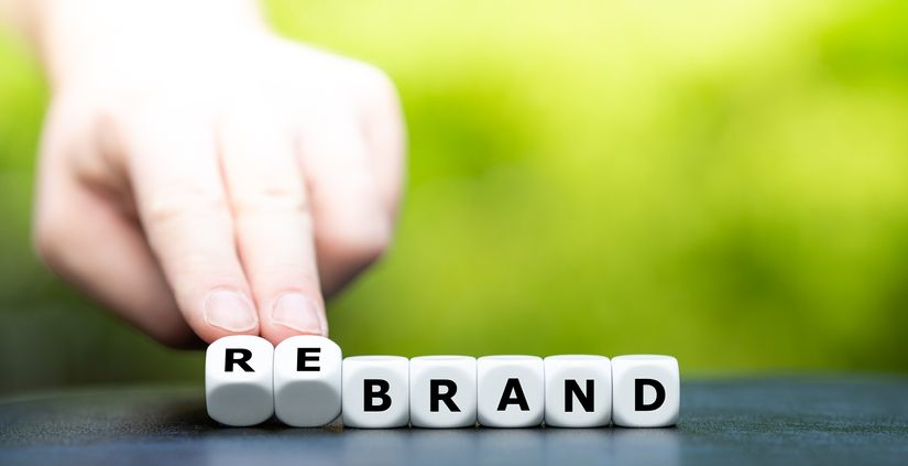 A stock photo featuring dices forming the word "rebrand"