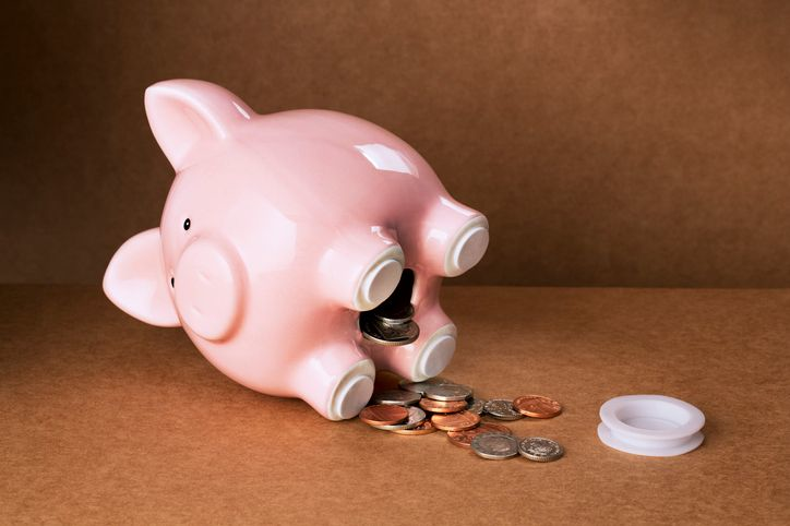 A photo of a piggy bank drained for money. 