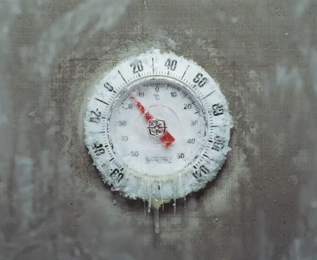 Ice covered thermometer, close-up - stock photo