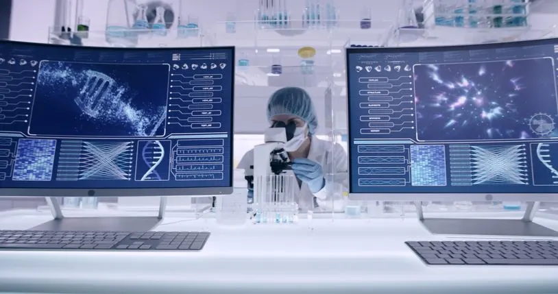 Stock photo of a scientist examining DNA models in a modern genetic research laboratory