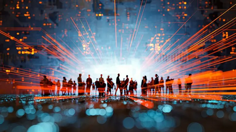 A stock image of a crowd in the neon lights. 