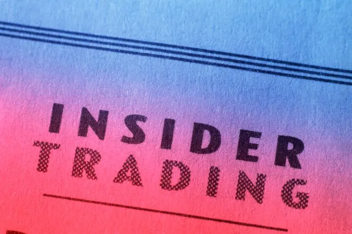 A stock photo featuring the "Insider Trading" headline