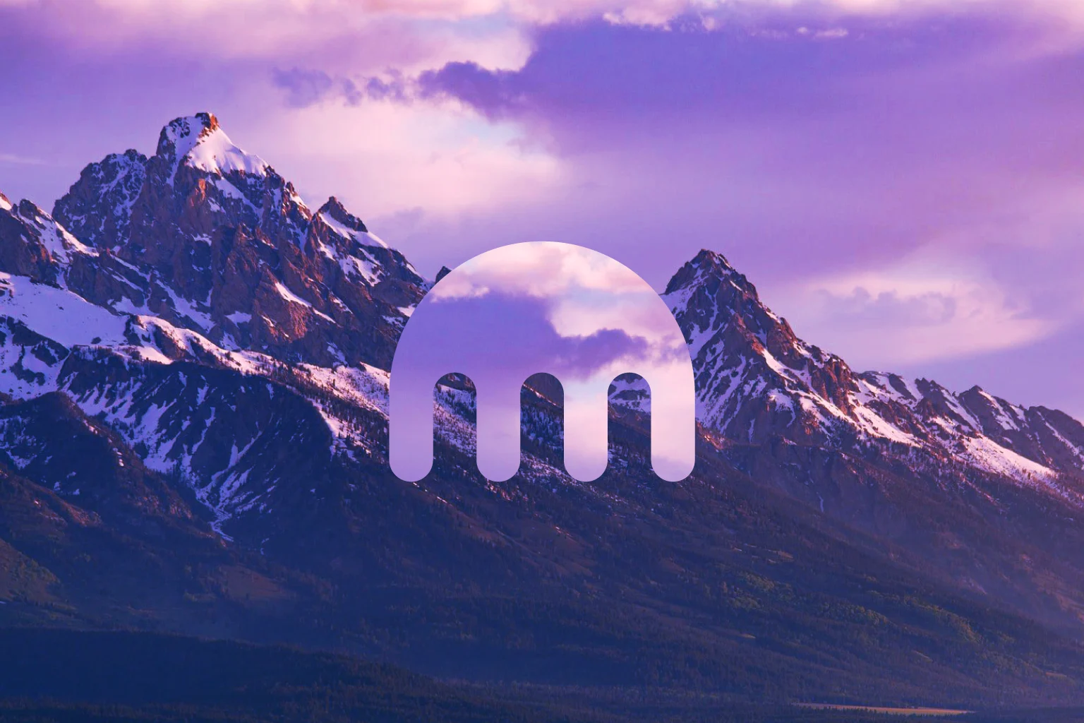 Kraken logo against the backdrop of mountains and clouds