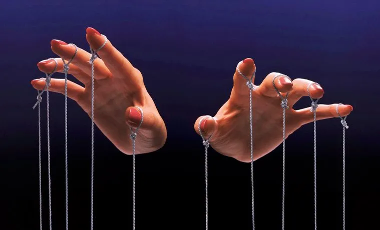 Fingers of a puppeteer - stock photo