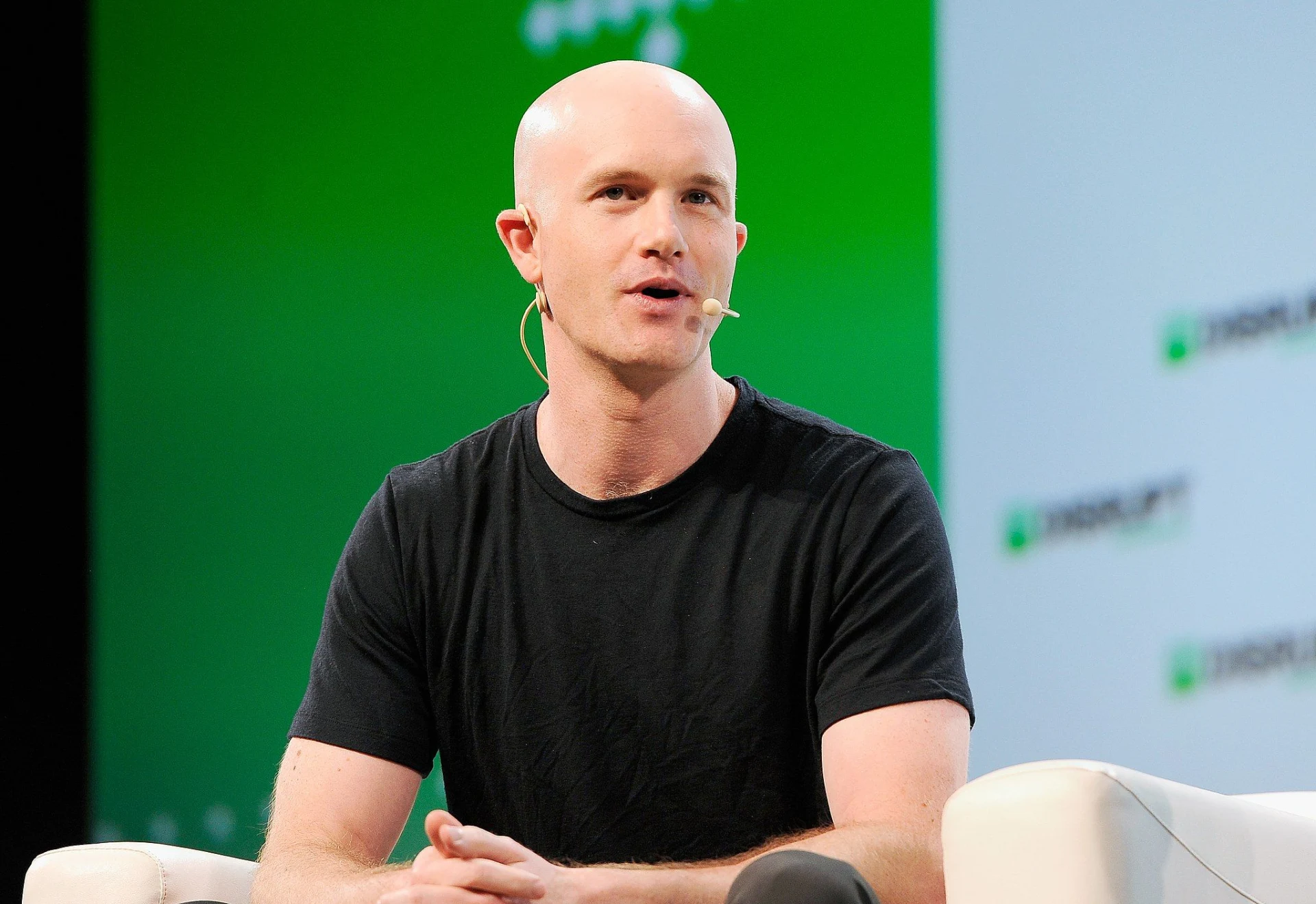 Brian Armstrong speaking at a conference