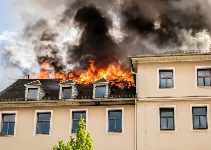 House with a roof on fire