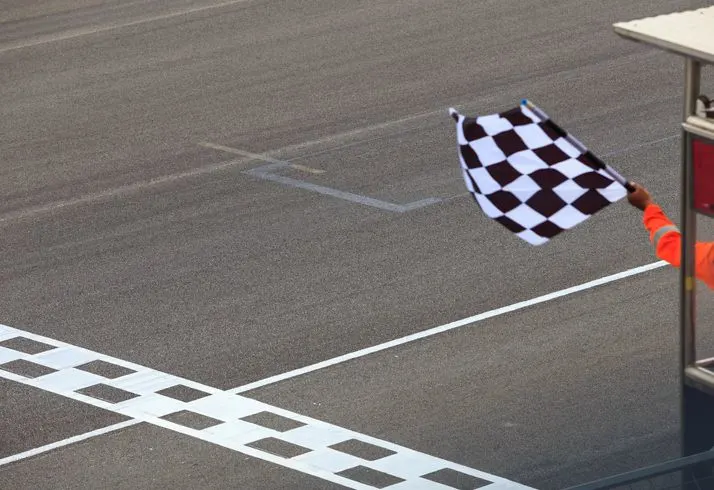 Racing track finish line and a chequered flag