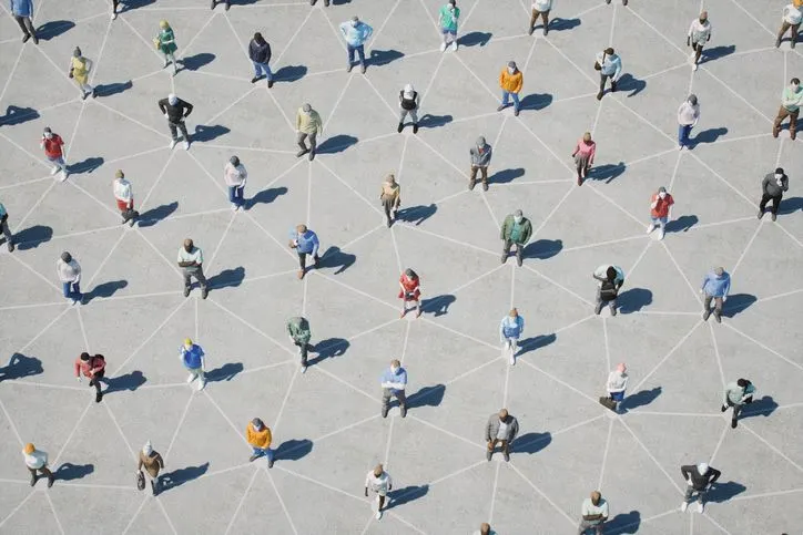 A stock image of 3d low-poly models of people connected with invisible links. 