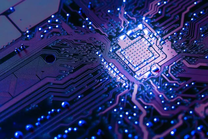 A stock photo of a close up electronic circuit board. 