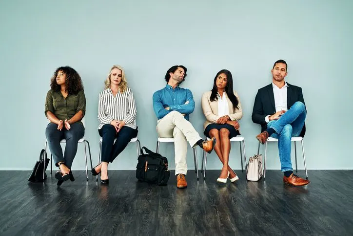 Bored people sitting on chairs, waiting