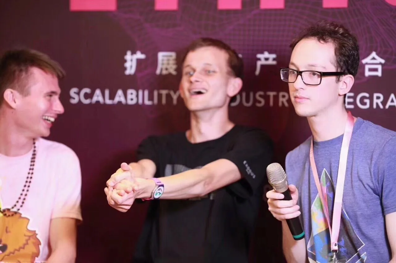 Hayden Adams (right) with Vitalik Buterin (center) at ETHIS conference in Hong Kong, 2018