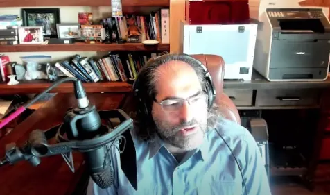 David Schwartz sitting in a study